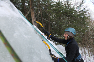 Polina Chizhov, a member of the Syracuse University Outing Club, ice climbs during one of the organization’s adventure outings.