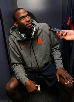 Baye Moussa-Keita (12) of the Syracuse Orange responds in the locker room during the Final Four interviews