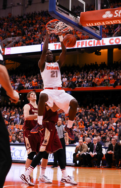 Sophomore Tyler Roberson throws down a two-handed dunk in front of two Eagles defenders. The forward had six points in the opening 20 minutes.