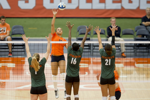 Syracuse outside hitter Silvi Uattara bats a ball over Miami's front line.