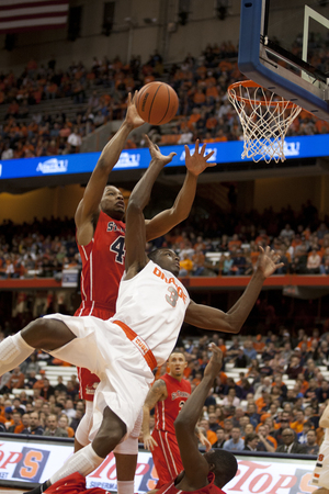 Syracuse forward Jerami Grant draws a foul on his way to the basket. The Orange sunk its final four free throws to ice a comeback victory against St. Francis (N.Y.).