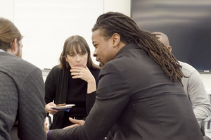 Debbie Bial and David Jackson talk in a classroom in the S.i. Newhouse School of Public Communications. Bial, the president of the Posse Foundation, visited the SU campus Wednesday to interact with Posse scholars and learn what they’re doing at SU.     