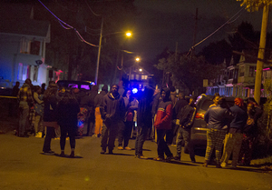 The scene around the location of a shooting that left a 15-year-old dead and a 17-year-old wounded was emotional with some community members weeping and others puzzled.