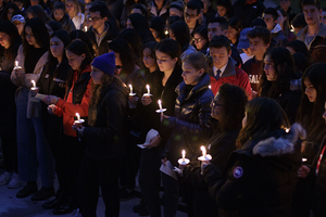 Students gather for a moment of silence. 