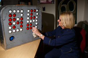 Inga Barnello unboxes and turns on LeMoyne's 64-year-old aluminum shot clock. 