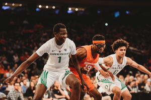 Bol Bol (left) made life miserable in the paint for the Orange, scoring 26 points on 11-17 shooting.