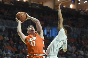 Joe Girard III hit a layup and a jumper to tie the game for Syracuse late in regulation.