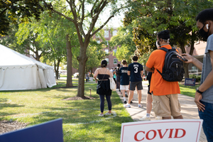 Students line up for COVID-19 testing on the Quad. 