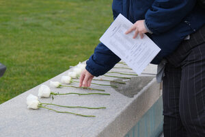 At the end of the ceremony, staff and attendees leave Hendricks Chapel to walk to the Shaw Quadrangle sign to lay white roses on top. The ceremony was held to commemorate the 119 people affiliated with Syracuse University and SUNY ESF who passed away in the past year.