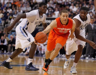 Syracuse guard Brandon Triche (20) drives the lane in the second half. 