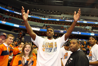 Rakeem Christmas #25 of the Syracuse Orange raises his hands in celebration.