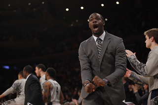 Georgetown's Assistant Coach Kenya Hunter cheers after Georgetown scores.