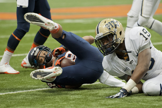 Clark falls to the ground after making a catch.