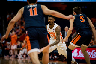 Ty Jerome (left) and Kyle Guy led UVA’s pack-line defense, and they also led the offense Monday. They helped UVA tie a school record of 18 3-pointers made.