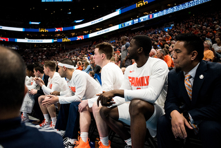 The SU walk-ons look on. 