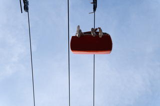 Fairgoers ride above Wade Shows Midway on the Broadway Skyliner at the New York State Fair