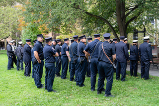 Firefighters from the Syracuse Fire Department stand to show their support and respect at the 17 Minutes of Silence ceremony. 