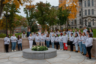 Remembrance Scholars gathered at the Place of Remembrance for the vigil. Josh Meyers, one of this year’s scholars, said during the event that he had found the antisemitic language and swastika in the Remembrance archives.